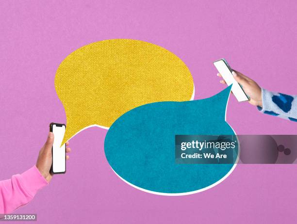 two women having a virtual conversation via smartphone - interview icon stock pictures, royalty-free photos & images