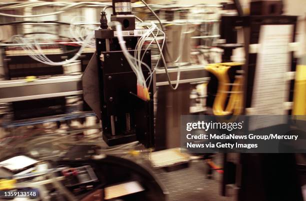 Photograph by Nhat V. Meyer in Palo Alto on Friday, June 9, 2000. A robotic arm of the "M13 DNA Preparation Robot" moves at the Stanford Genome...