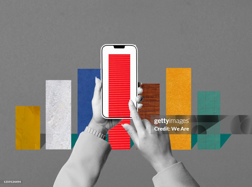 Conceptual image of man using smartphone to view bar graph