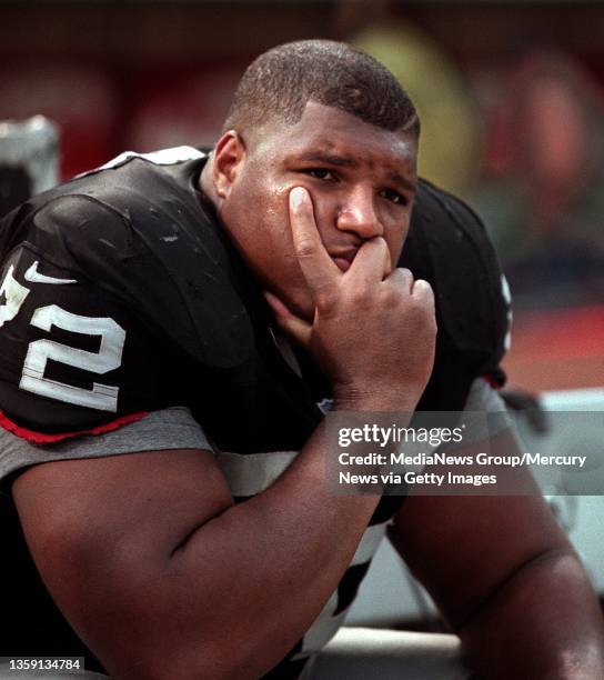 Raider DT Russell Maryland sits dejected on the bench after the game. The Raiders lost to the New Orleans Saints 13-10.