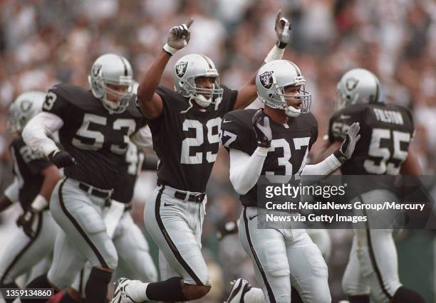 Raiders Celebrate- Corner back Albert Lewis and safety James Trapp celebrate after holding Denver and not allowing the first down and forced to punt...