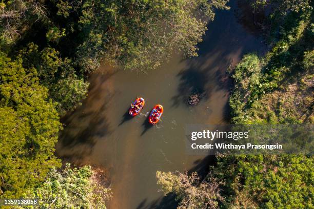 aerial view of a group of men and women white water river rafting - 祖谷渓 ストックフォトと画像