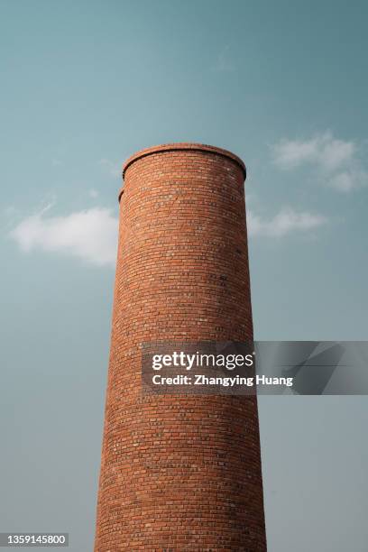 a brick chimney in the sunny afternoon - smoke stack stock pictures, royalty-free photos & images