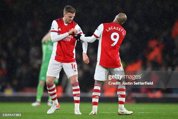 Alexandre Lacazette of Arsenal hands the Captain’s armband to Rob Holding of Arsenal during the Premier League match between Arsenal and Southampton...