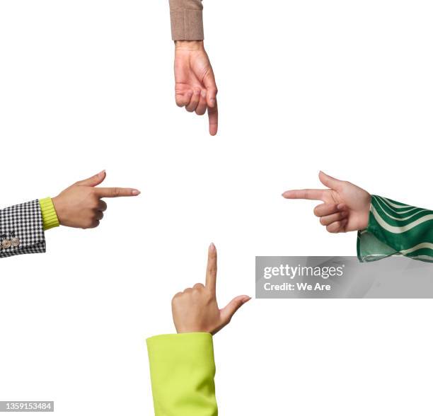 four hands pointing to centre of frame - pioint stock pictures, royalty-free photos & images