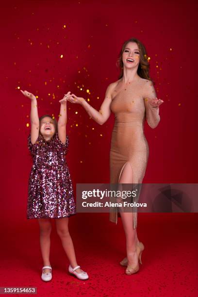 portrait of beautiful mother and daughter  celebraiting christmas - luxury girl stock pictures, royalty-free photos & images