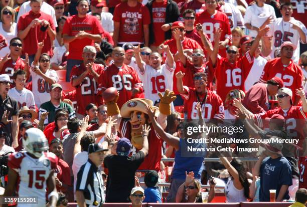 The San Francisco 49ers mascot "Sourdough Sam" celebrates after catching a ball in the stands during their game against the Arizona Cardinals in the...