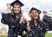 Cropped portrait of two attractive young female students celebrating on graduation day