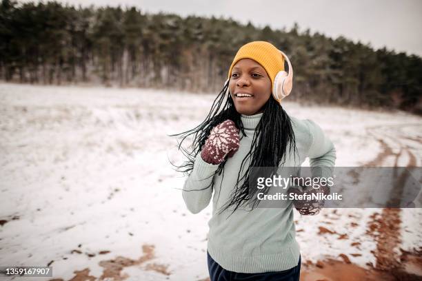 fitness running woman in winter season - jogging winter stock pictures, royalty-free photos & images