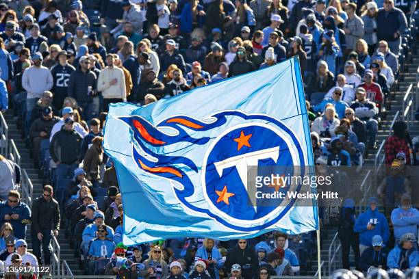 Cheerleader of the Tennessee Titans waves the team flag after a touchdown during a game against the Jacksonville Jaguars at Nissan Stadium on...