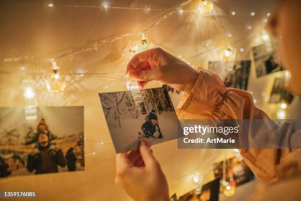 family memories in christmas time - christmas photo album stock pictures, royalty-free photos & images