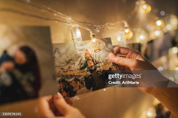 family memories in christmas time - christmas photo album stock pictures, royalty-free photos & images