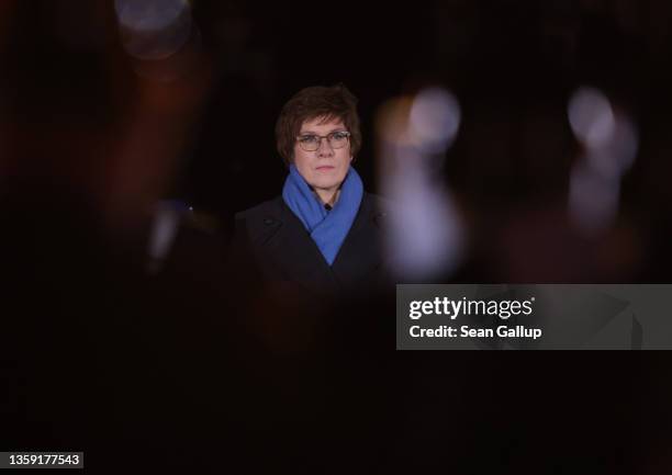 Former German Defense Minister Annegret Kramp-Karrenbauer observes the military tattoo farewell ceremony for her on December 15, 2021 in Berlin,...