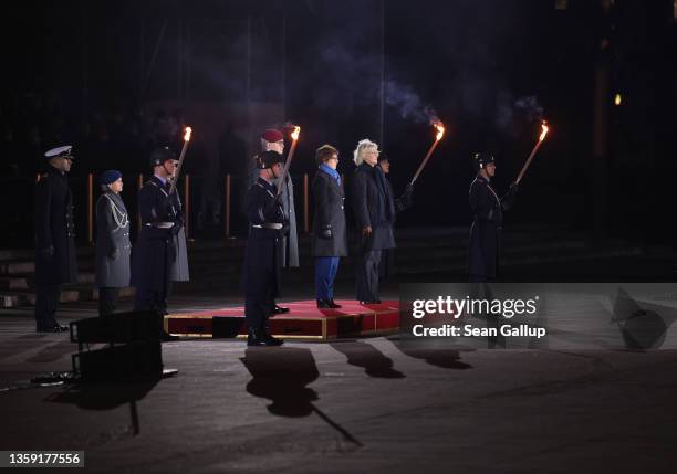 Former German Defense Minister Annegret Kramp-Karrenbauer , flanked by new Defense Minister Christine Lambrecht and General Eberhard Zorn , Inspector...