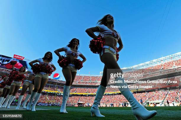 Members of the Gold Rush cheerleaders walk onto the field before the San Francisco 49ers vs. Chicago Bears NFL game at Levi's Stadium in Santa Clara,...