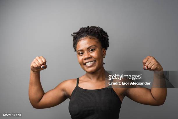 portrait of black female athlete in studio - portrait solid stock pictures, royalty-free photos & images