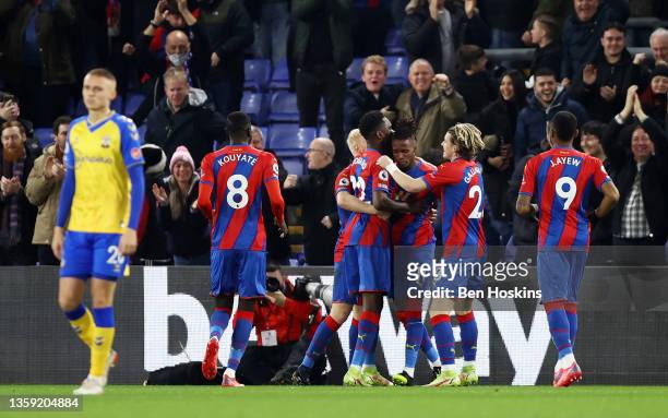 Wilfried Zaha of Crystal Palace celebrates after scoring their sides first goal with team mates Will Hughes, Odsonne Edouard and Conor Gallagher...