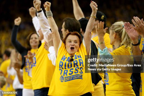 The Golden State Warriors fans celebrate after the Warriors scored the go-ahead basket after coming back from a 20-point deficit against the San...