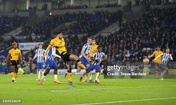 Romain Saiss of Wolverhampton Wanderers scores their sides first goal during the Premier League match between Brighton & Hove Albion and...