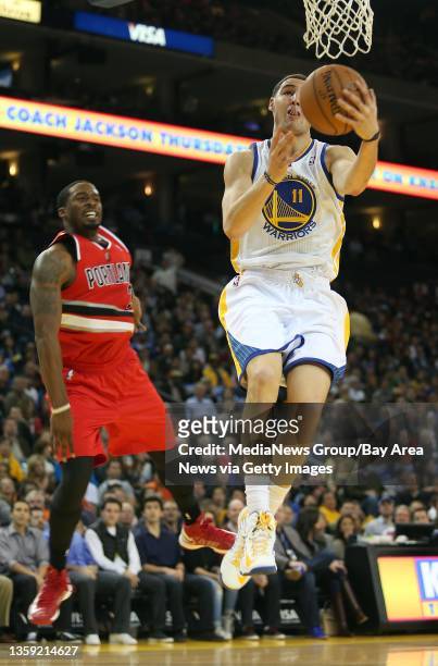 Golden State Warriors' Klay Thompson goes to the hoop past Portland Trail Blazers' Wesley Matthews during the first quarter of their game at Oracle...