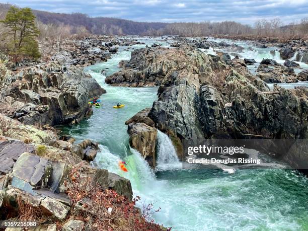 kayaking down great falls national park waterfall - k1 kayaking stock pictures, royalty-free photos & images