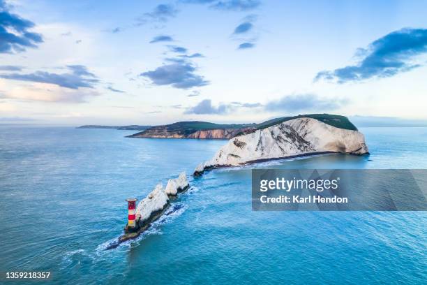 an aerial daytime view of the needles lighthouse, isle of wight - stock photo - isle of wight aerial stock pictures, royalty-free photos & images