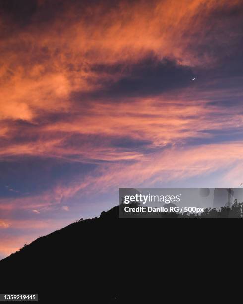 colores mgicos,low angle view of silhouette of mountain against dramatic sky,gama,cundinamarca,colombia - cundinamarca stock pictures, royalty-free photos & images