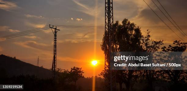 some endings are just amazing,low angle view of silhouette of trees against sky during sunset,islamabad,pakistan - islamabad ストックフォトと画像