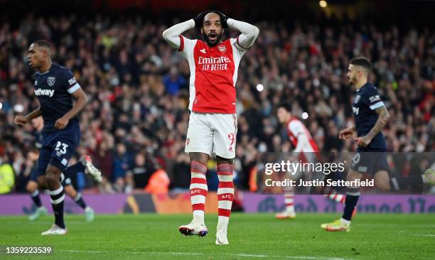 Alexandre Lacazette of Arsenal reacts after missing a penalty during the Premier League match between Arsenal and West Ham United at Emirates Stadium...