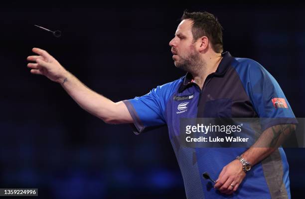 Adrian Lewis of England in action during his First Round match against Matt Campbell of Canada during the William Hill World Darts Championship at...