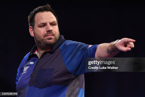 Adrian Lewis of England reacts during his First Round match against Matt Campbell of Canada during the William Hill World Darts Championship at...