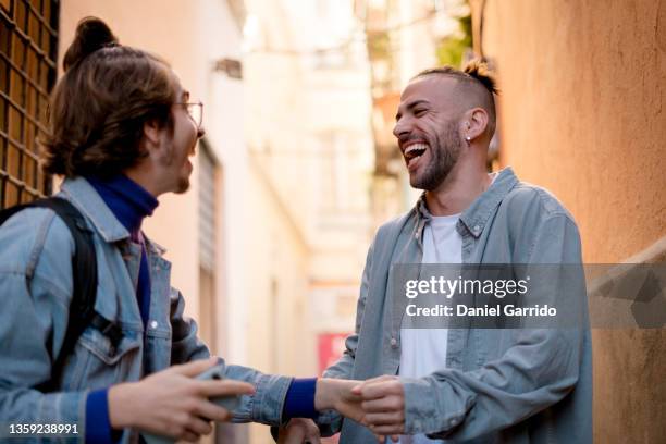 two friend laughing a lot, enjoying life, lifestyle portrait, city life - costa del sol málaga province stock pictures, royalty-free photos & images