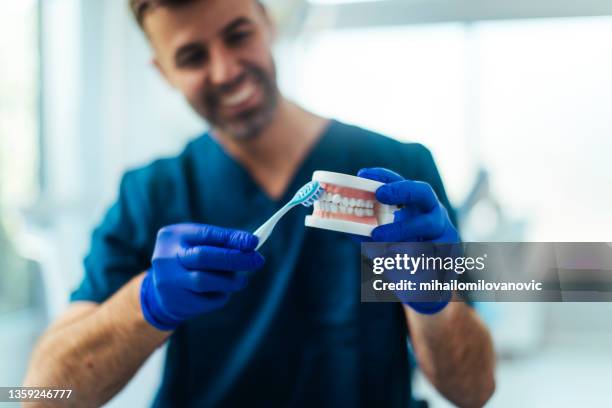 teaching you how to brush - dental calculus stock pictures, royalty-free photos & images