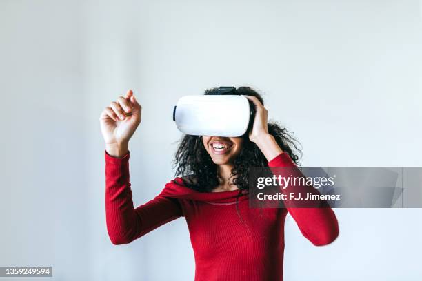 woman with virtual reality glasses - virtual reality simulator stock pictures, royalty-free photos & images