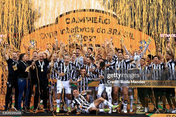 Players of Atletico Mineiro celebrate with the champion tropy after winning the second leg match between Athletico Paranaense and Atletico Mineiro as...