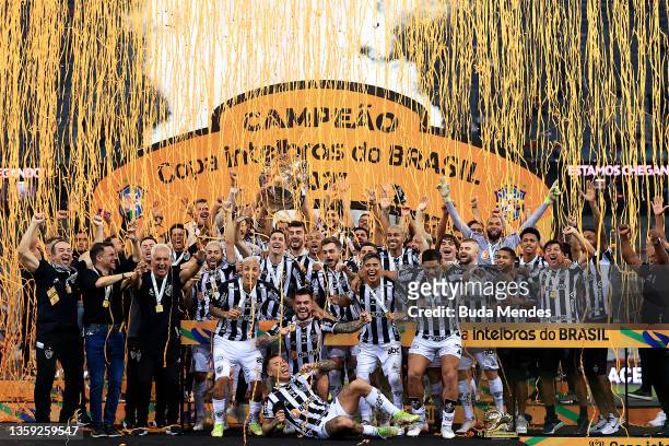 Players of Atletico Mineiro celebrate with the champion tropy after winning the second leg match between Athletico Paranaense and Atletico Mineiro as...