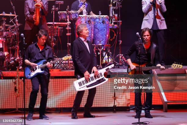 Tony Obrohta, Robert Lamm and Brett Simons of the band Chicago perform at The Grand Ole Opry on December 15, 2021 in Nashville, Tennessee.