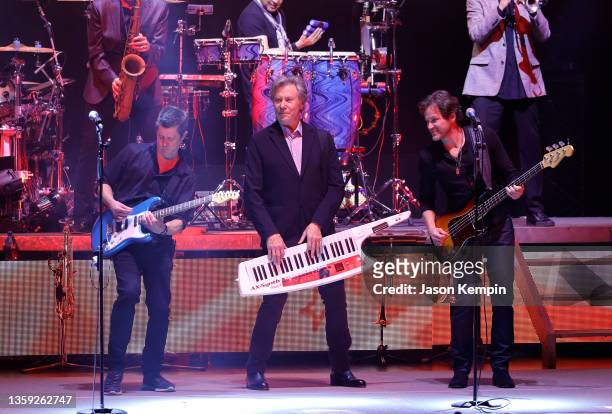 Tony Obrohta, Robert Lamm and Brett Simons of the band Chicago perform at The Grand Ole Opry on December 15, 2021 in Nashville, Tennessee.