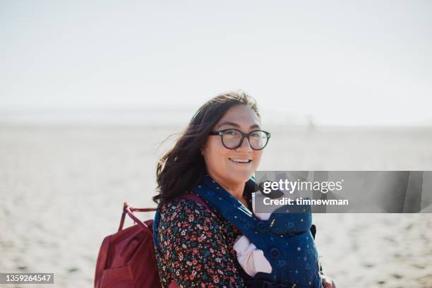 happy mother on the oregon coast with her baby daughter - pacific stock pictures, royalty-free photos & images