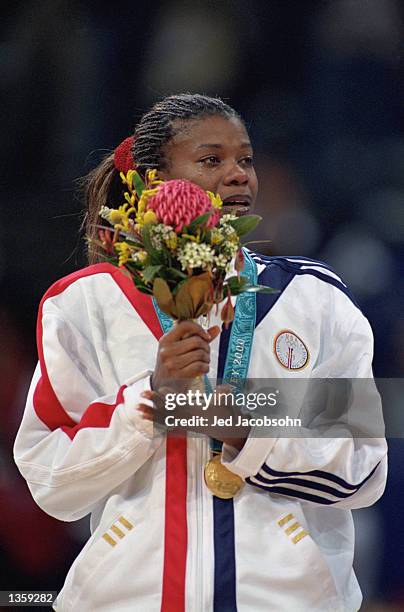 Sheryl Swoopes of the USA is overcome with emotion as she stands during the medal ceremony after the women's basketball Gold Medal game against...