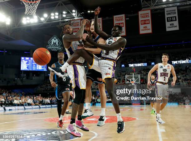 Jarell Martin of the Kings and Brad Newley of Melbourne United compete for a rebounds the ball during the round three NBL match between Melbourne...