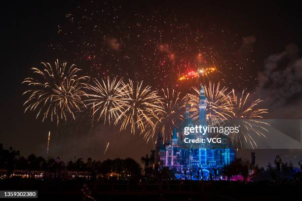 Special fireworks explode over the castle which is illuminated with a light show displaying 'Thank you' in multiple languages to thank the heroes in...