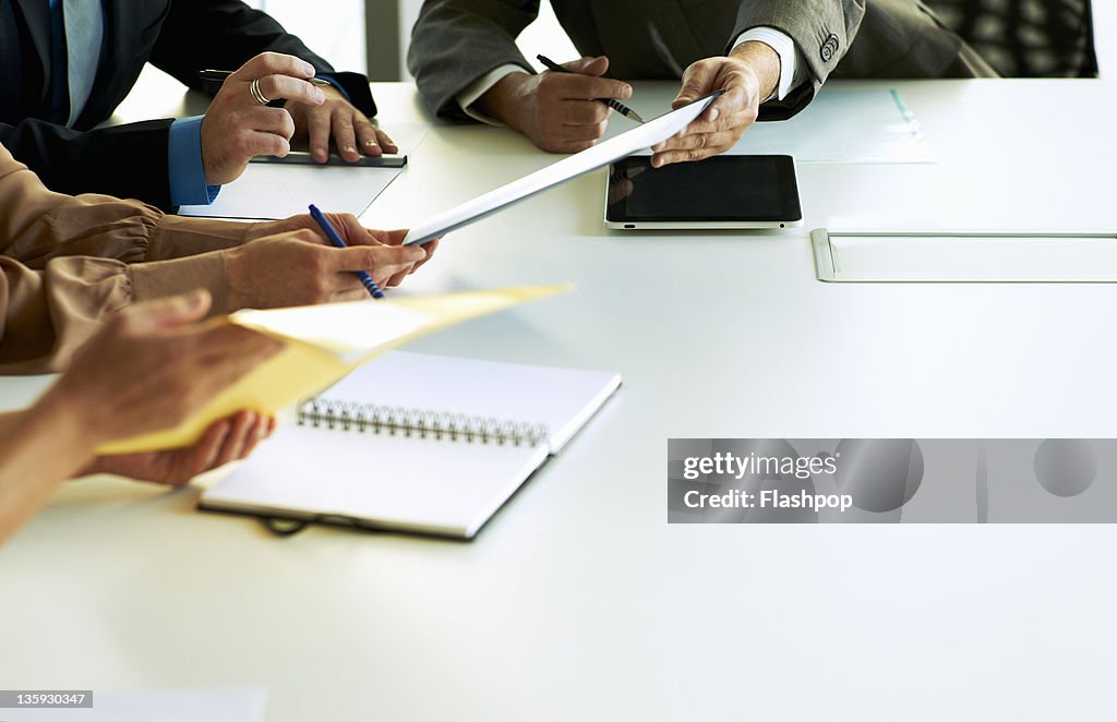 Close-up of hands in business meeting