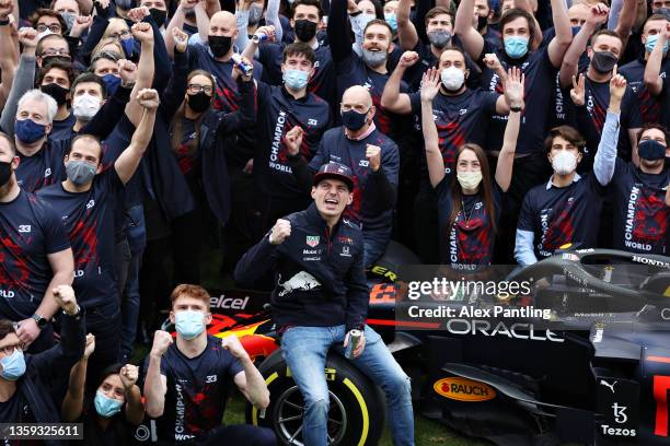 World Drivers Champion Max Verstappen of Netherlands and Red Bull Racing poses for a photo with his team at Red Bull Racing Factory on December 15,...