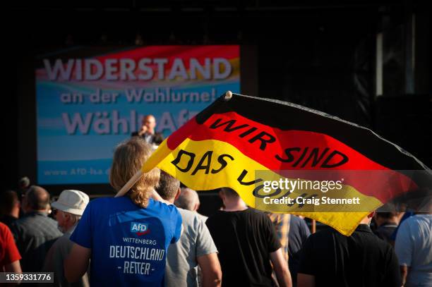 An AfD supporter attending the political parties end of Regional State Elections Rally on June 4,2021 in Magdeburg, Saxony-Anhalt, Germany in 2021...