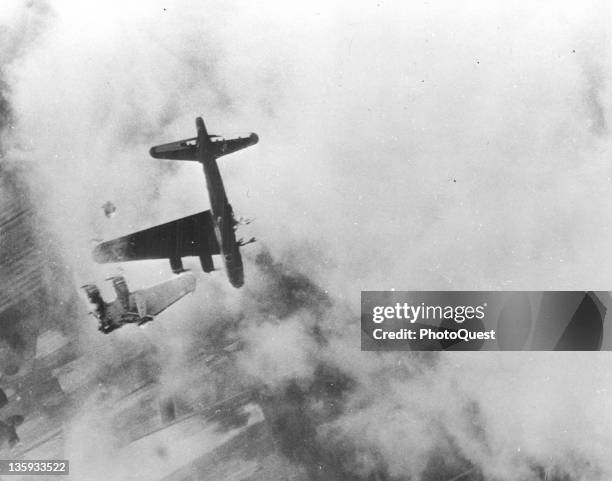 Cannon fired from a Messerschmitt has chopped off the wing of this B-17 as US Army 8th AF planes strike airdromes and a 100-building ordnance depot...