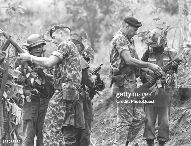 Green Beret troops train South Vietnamese soldiers in marksmanship with live ammunition, December 19, 1964. Sgt. Stanley Harold and Capt Robert Lopez...