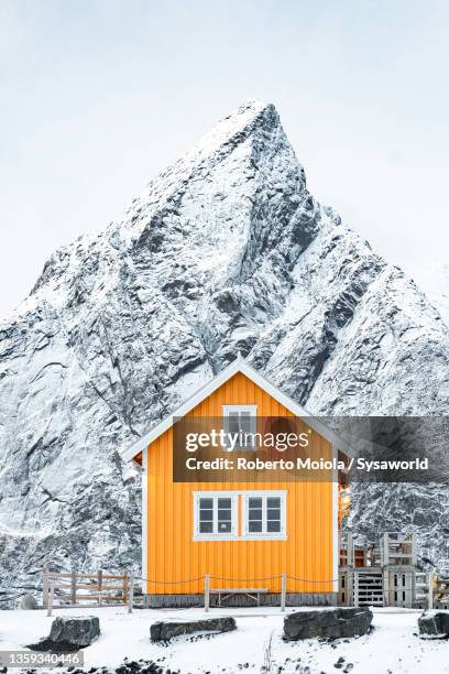 fisherman cabin and mountains covered with snow, norway - cottage bildbanksfoton och bilder