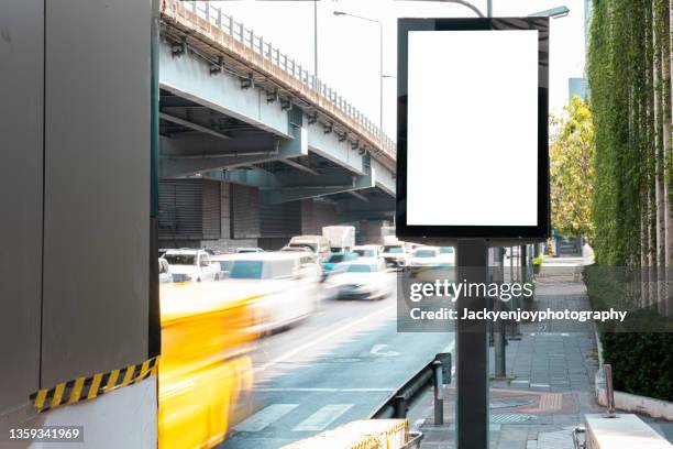 blank billboard on city street. outdoor advertising - bus stop poster stock pictures, royalty-free photos & images