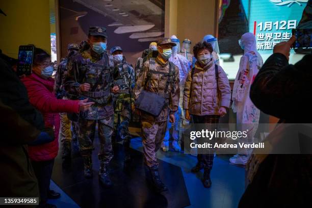 People visit the section of the museum dedicated to the war against Covid 19 at the Museum of the Communist Party of China on December 16, 2021 in...